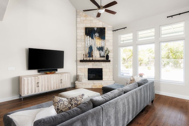 living room featuring a fireplace, high vaulted ceiling, and dark wood finished floors