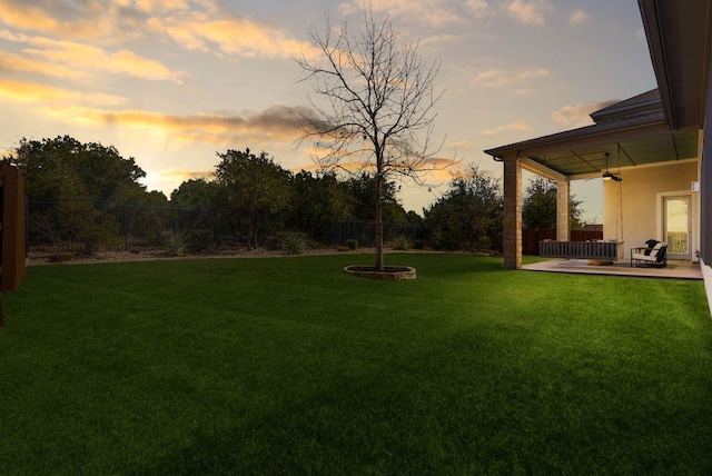 view of yard featuring fence and a patio