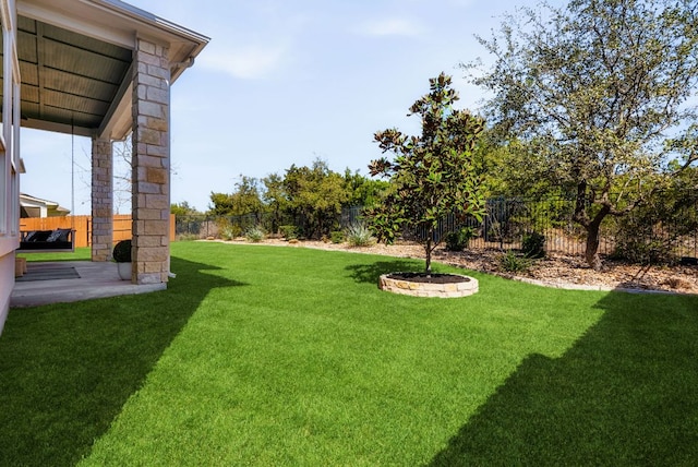 view of yard with a patio area and a fenced backyard