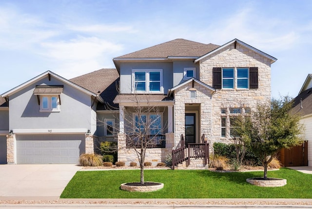 craftsman-style house with stucco siding, a shingled roof, a garage, driveway, and a front lawn