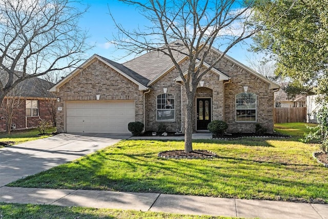 ranch-style home featuring an attached garage, brick siding, fence, driveway, and a front yard