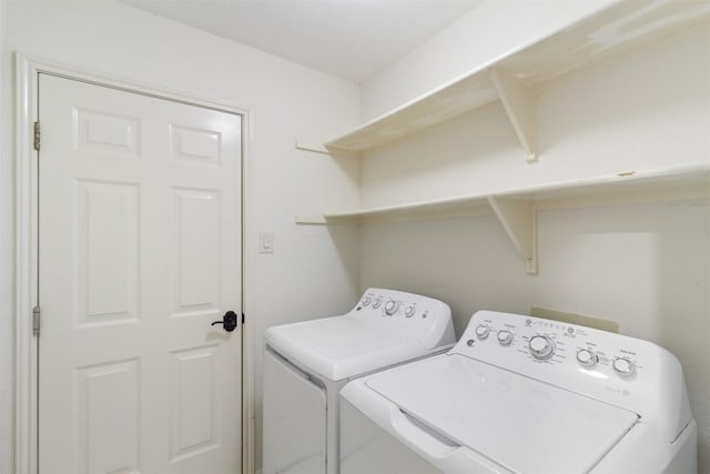 washroom with laundry area and washing machine and dryer