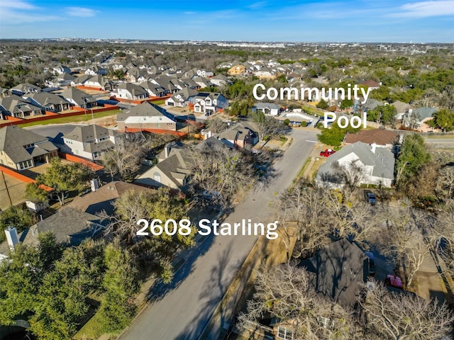 birds eye view of property with a residential view