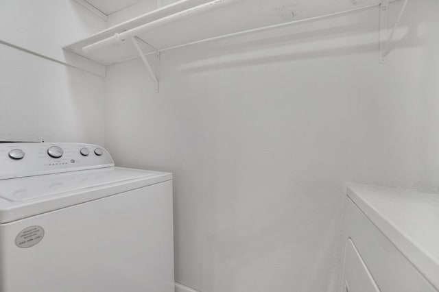 washroom with washer / clothes dryer and laundry area