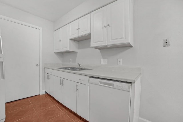 kitchen featuring dishwasher, a sink, light countertops, white cabinets, and tile patterned floors