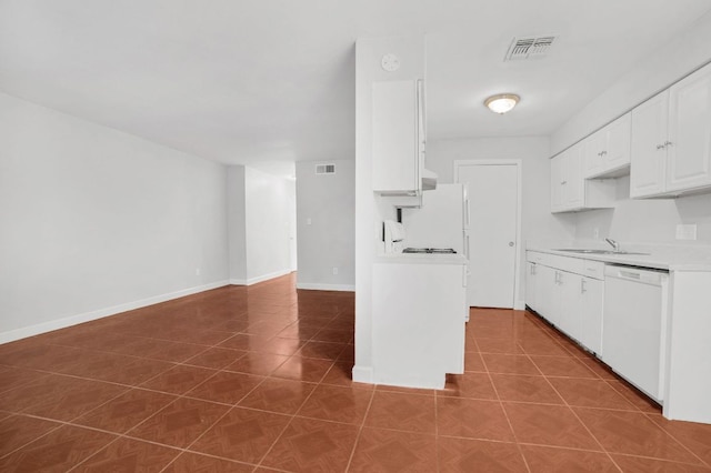 kitchen with visible vents, a sink, tile patterned flooring, and dishwasher