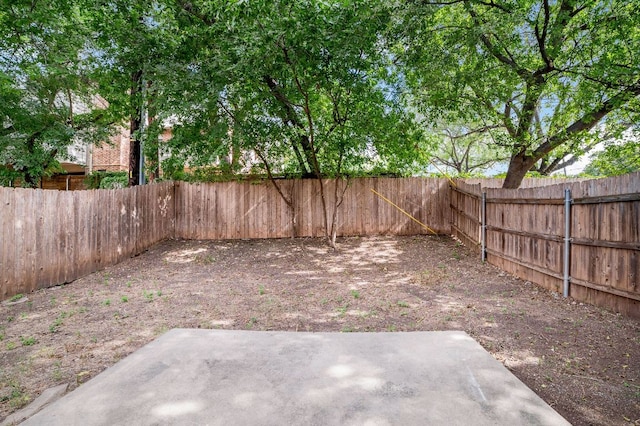 view of yard featuring a fenced backyard and a patio area