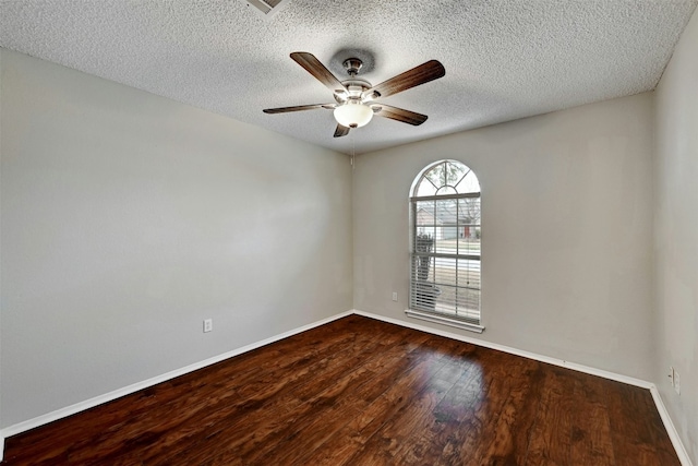 1807 Hollow Tree Blvd, Round Rock, TX 78681 - unfurnished room featuring a textured ceiling, ceiling fan, and dark wood finished floors
