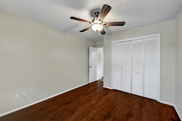1807 Hollow Tree Blvd, Round Rock, TX 78681 - unfurnished bedroom featuring dark wood-style flooring, a closet, a textured ceiling, and ceiling fan