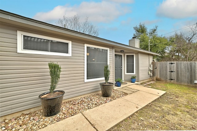 1807 Hollow Tree Blvd, Round Rock, TX 78681 - view of home's exterior with a chimney