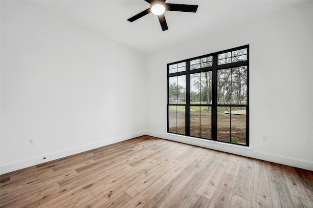 360 Judy Dr, Dripping Springs, TX 78620 - empty room featuring light wood-style flooring, baseboards, and a ceiling fan
