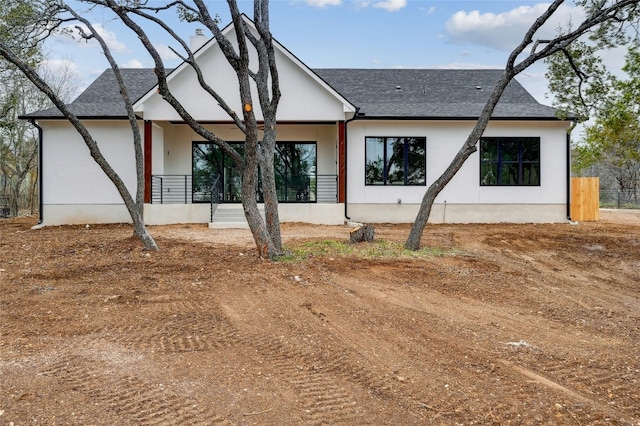 360 Judy Dr, Dripping Springs, TX 78620 - exterior space featuring stucco siding, roof with shingles, and fence