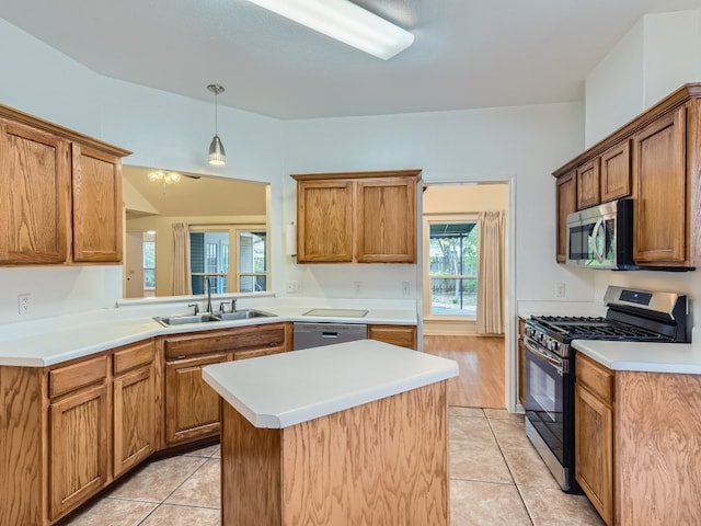 kitchen featuring light tile patterned floors, stainless steel appliances, a sink, and a center island