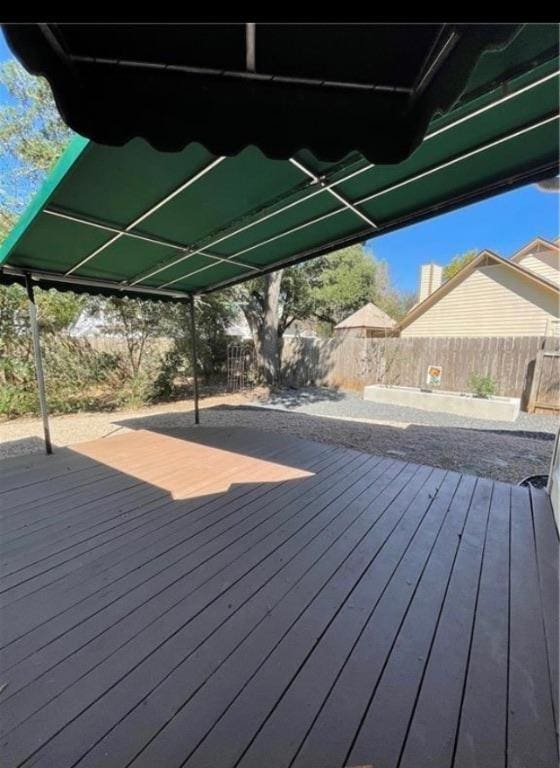 deck with a fenced backyard