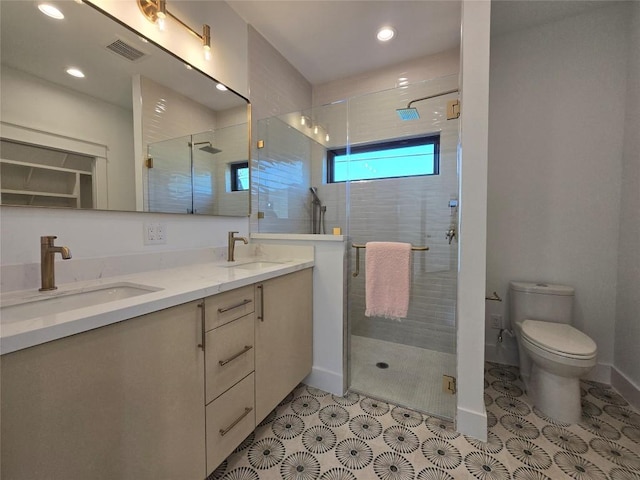 5305 Grover Ave Unit 2, Austin, TX 78756 - bathroom featuring double vanity, a stall shower, recessed lighting, and tile patterned floors