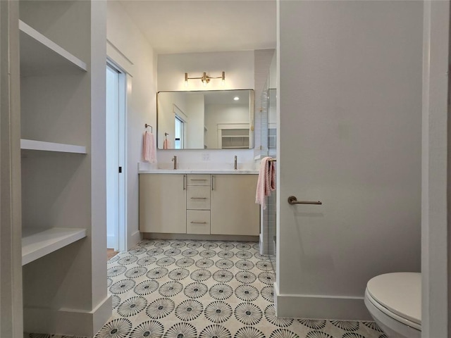 5305 Grover Ave Unit 2, Austin, TX 78756 - bathroom featuring double vanity and baseboards