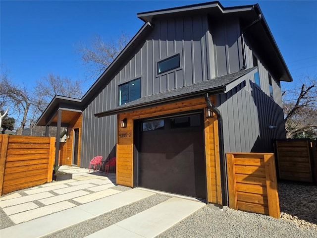 5305 Grover Ave Unit 2, Austin, TX 78756 - contemporary house with board and batten siding, an attached garage, and driveway