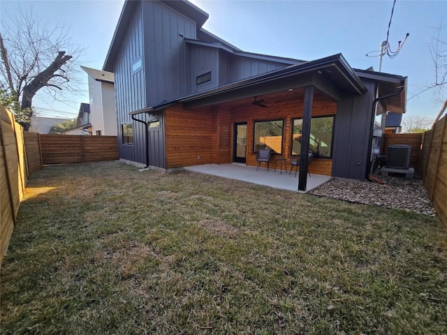 5305 Grover Ave Unit 2, Austin, TX 78756 - rear view of house featuring board and batten siding, ceiling fan, a patio, and a fenced backyard