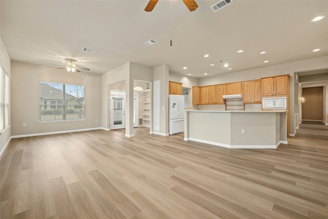 122 Durango Trl, Georgetown, TX 78633 - kitchen with ceiling fan, white appliances, open floor plan, light wood finished floors, and baseboards