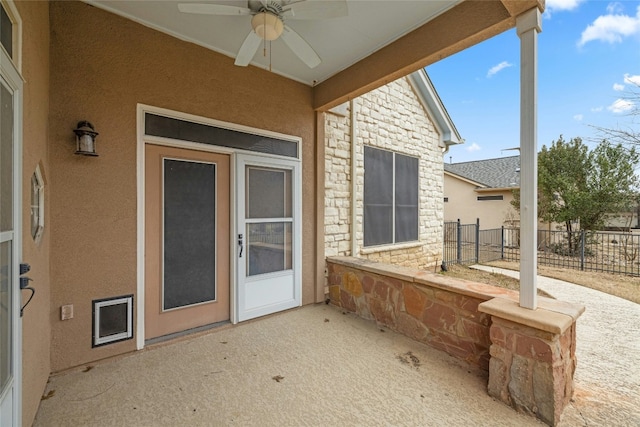 view of patio / terrace featuring fence and a ceiling fan