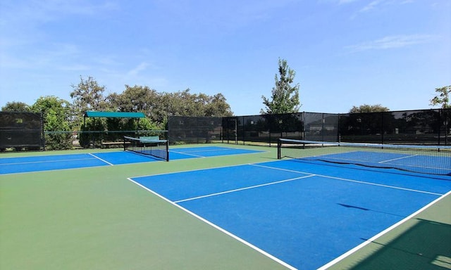 view of sport court with community basketball court and fence