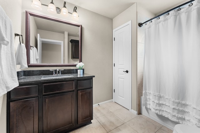 430 Archstone Loop, Belton, TX 76513 - full bathroom featuring tile patterned floors, vanity, shower / bath combo with shower curtain, baseboards, and toilet