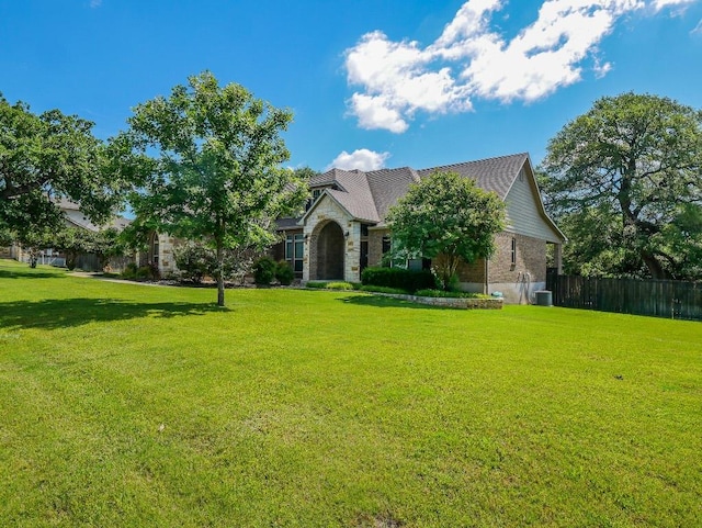 430 Archstone Loop, Belton, TX 76513 - view of front facade featuring central air condition unit and stone siding