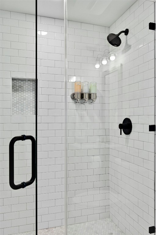 full bathroom featuring a shower stall
