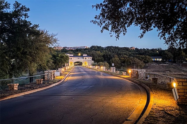 view of street featuring curbs