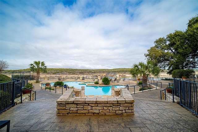 pool featuring a patio area
