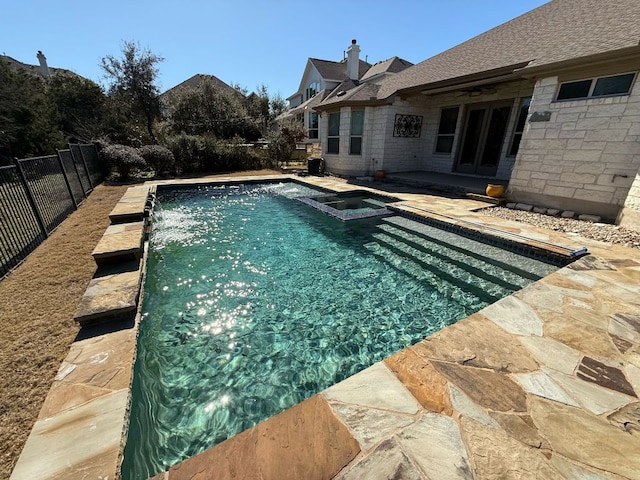 view of pool featuring ceiling fan, a patio, a fenced backyard, and a pool with connected hot tub