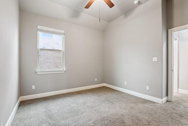 unfurnished room featuring lofted ceiling, carpet flooring, ceiling fan, and baseboards