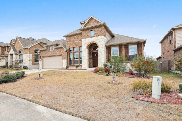 view of front of property with brick siding, concrete driveway, fence, a garage, and stone siding