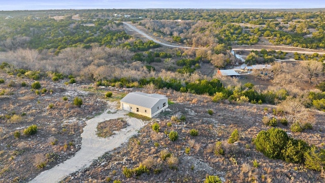 aerial view featuring a wooded view