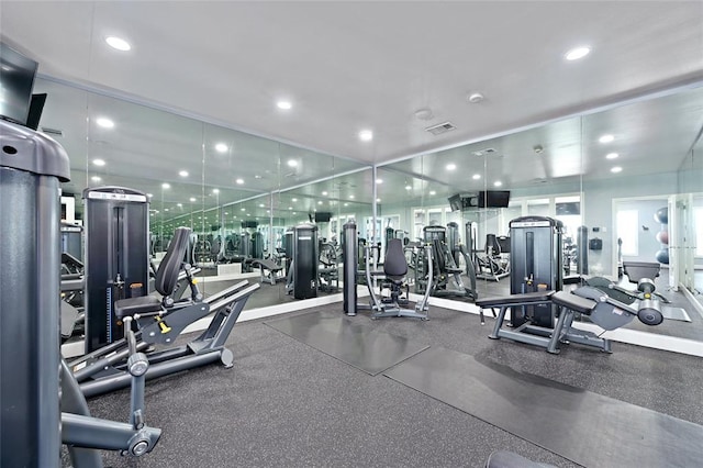 workout area featuring visible vents and recessed lighting