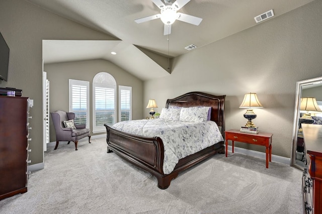 carpeted bedroom with lofted ceiling, visible vents, and baseboards