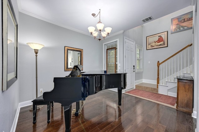 sitting room featuring stairs, visible vents, baseboards, and wood finished floors