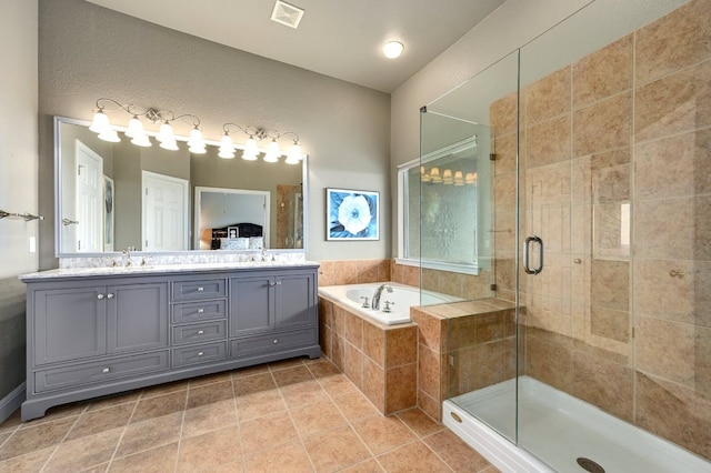 full bath with a sink, visible vents, a shower stall, a bath, and double vanity