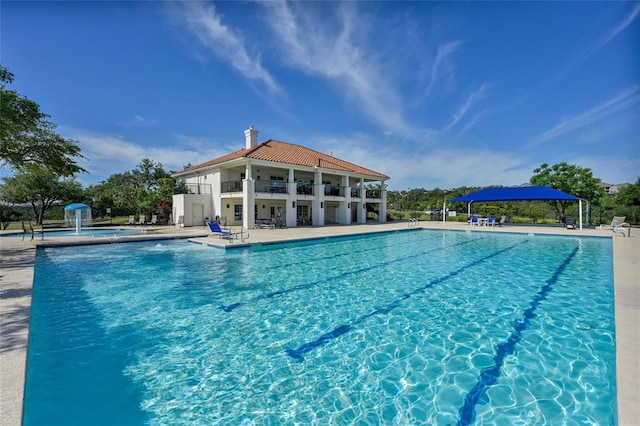 community pool with a patio area