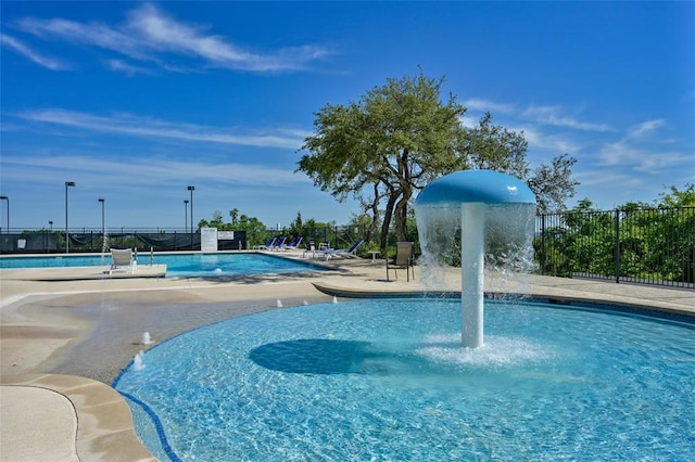 pool featuring a patio area and fence