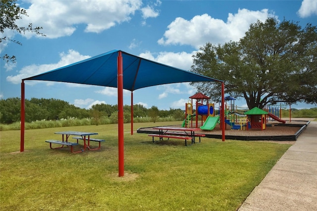 community jungle gym featuring a lawn