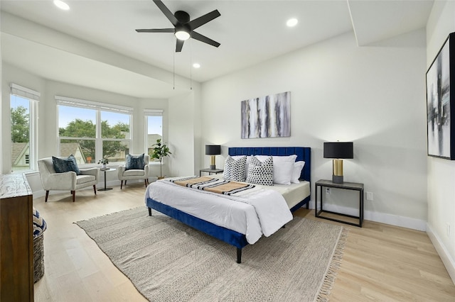 bedroom with recessed lighting, wood finished floors, a ceiling fan, and baseboards