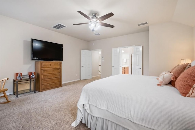 carpeted bedroom featuring a ceiling fan, visible vents, connected bathroom, and baseboards