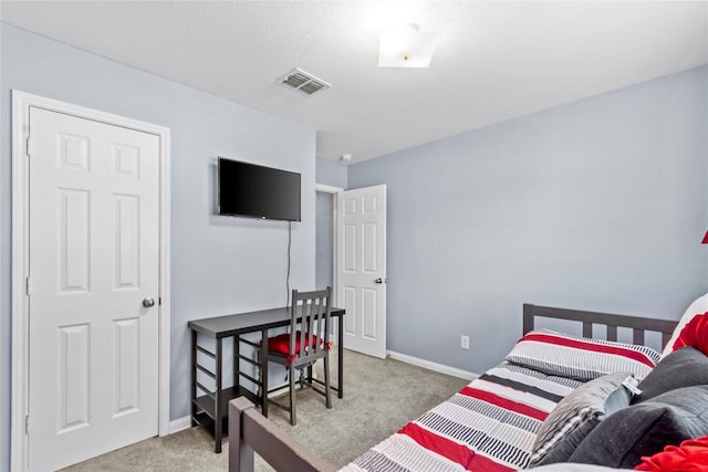 bedroom featuring baseboards, visible vents, and carpet flooring