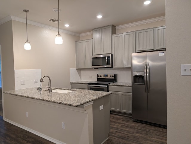 kitchen featuring dark wood-style floors, visible vents, appliances with stainless steel finishes, ornamental molding, and a sink