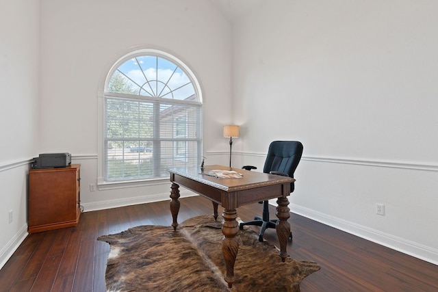 office space with wood-type flooring, vaulted ceiling, and baseboards