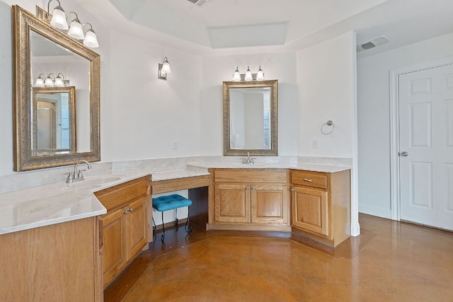 full bath featuring double vanity, a raised ceiling, visible vents, a sink, and concrete flooring