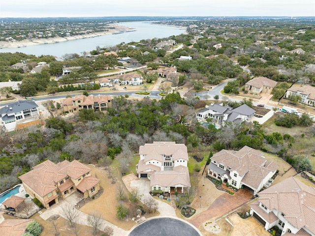 drone / aerial view featuring a water view and a residential view