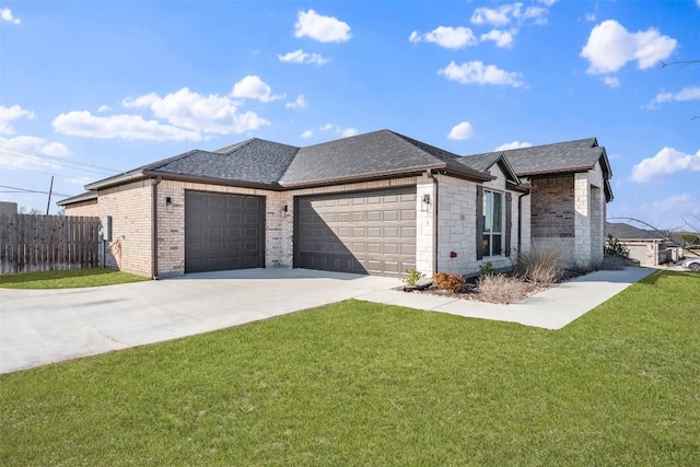 view of front facade with an attached garage, fence, driveway, roof with shingles, and a front lawn