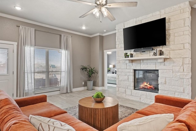 7701 Soapstone Ct, Temple, TX 76502 - living area featuring a stone fireplace, ceiling fan, crown molding, recessed lighting, and wood finished floors